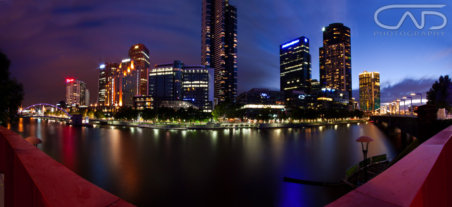Wide angle photograph, at sunset at South Bank on the Yarra River looking at Eureka Tower and Crown Casino at Melbourne, Victoria, Australia