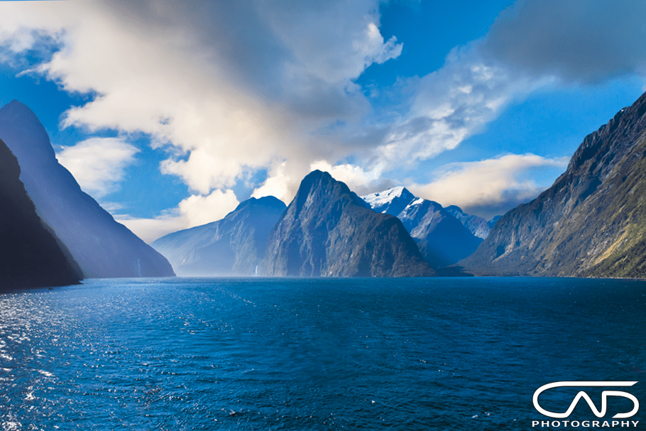 New Zealand, Milford Sound and its snowy mountains, photograph taken above the water from a Royal Caribbean cruise ship.
